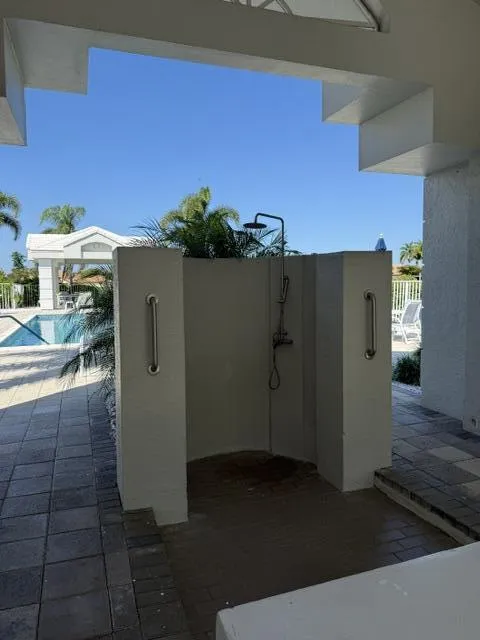 Community outdoor pool shower and updated mens and womans bathrooms
