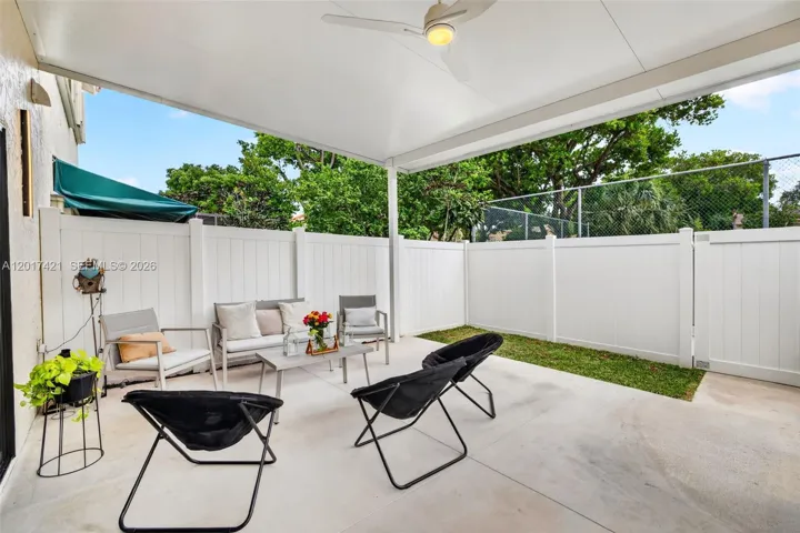 Amazing covered patio w/ new PVC fence, backs up to the pool area (& tennis which is currently closed) for the community. Plenty of room for hot tub or large dining table