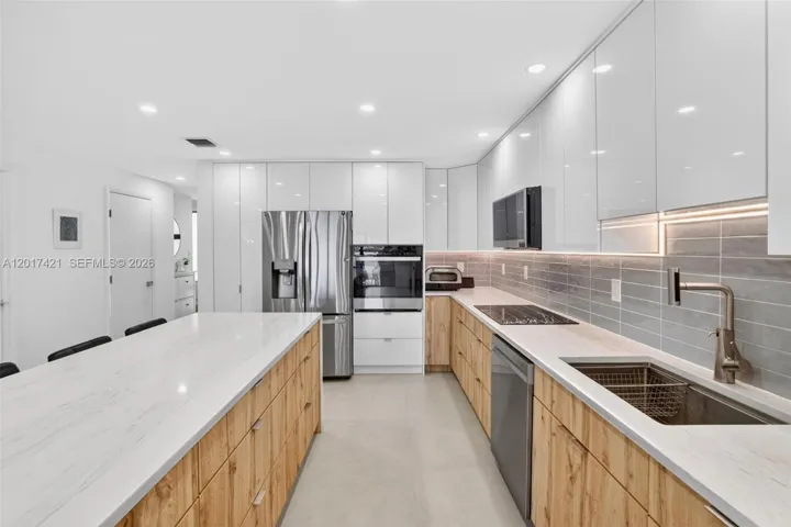 Oversized kitchen sink and tons of storage cabinets and drawers