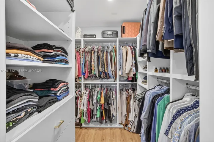 Gorgeous custom walk in closet in primary bedroom