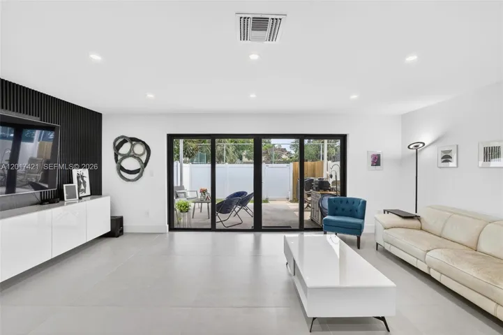 Oversized family room / great room (room for dining area as well (just move sofa closer to TV and add it behind)