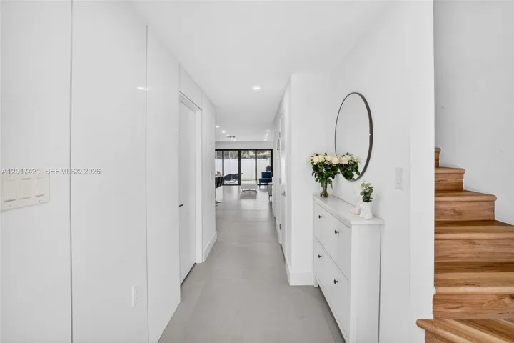 Foyer entrance with stairs leading up to 3 bedrooms & 2 bathrooms