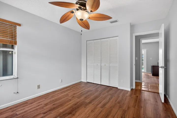 Large bedroom with porcelain tile floors.