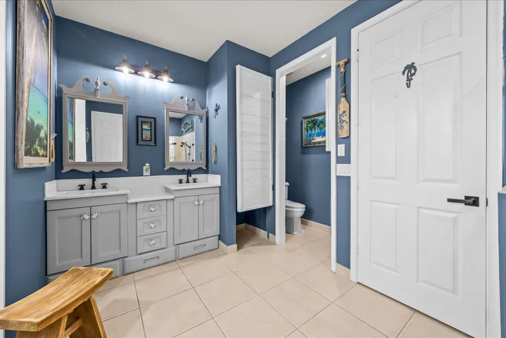 Separate water closet with added comfort height toilet