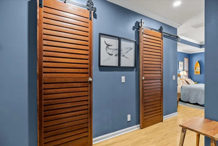 Primary bedroom dual closet barn doors...