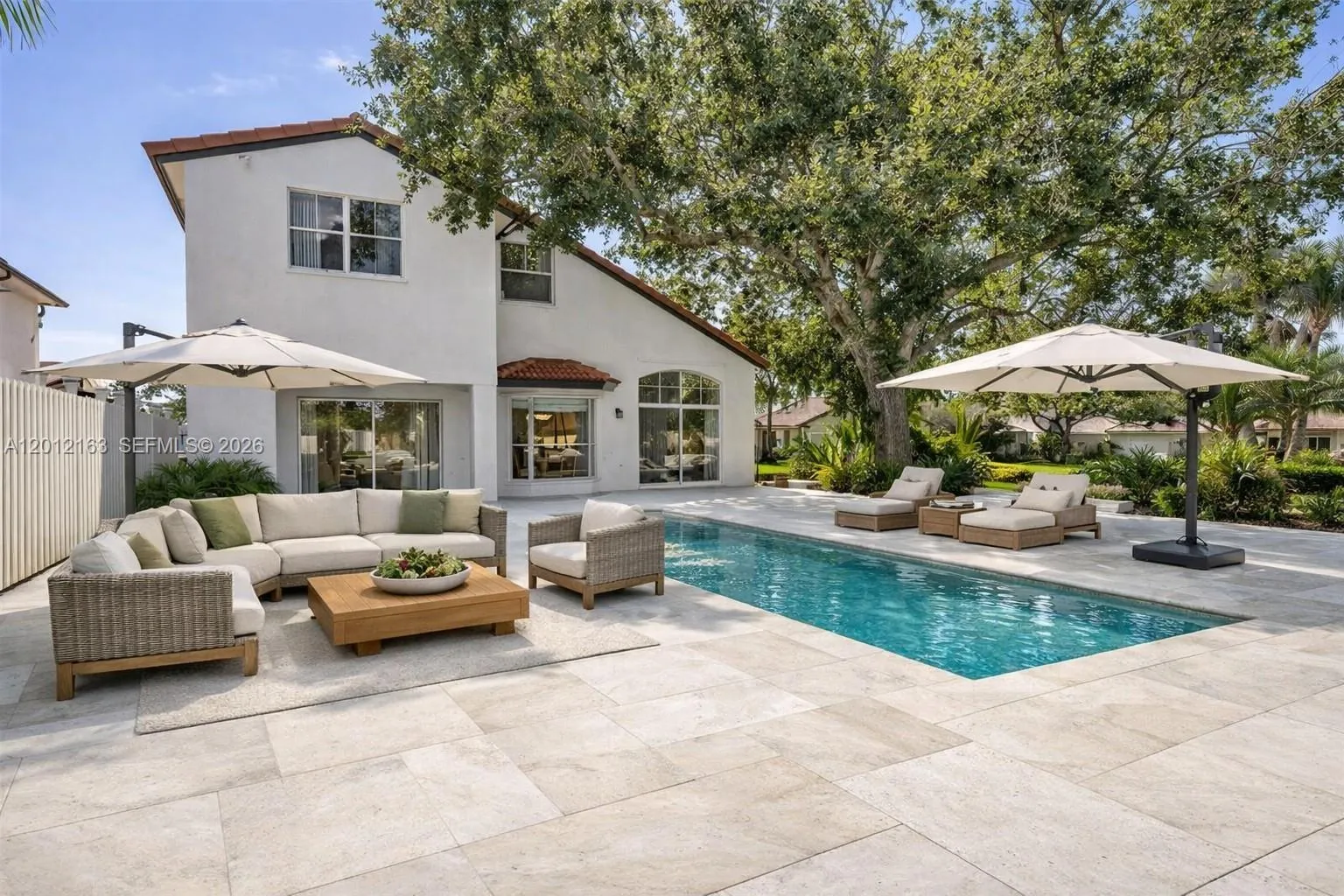 This home does NOT have a patio or pool. This photo is AI generated to show back yard potential.