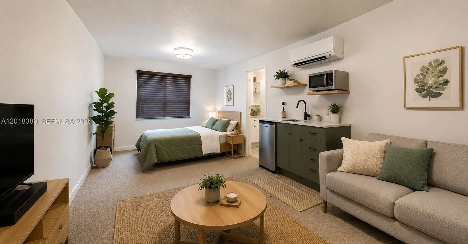 Virtually staged bonus room that could be an efficiency.These items are not in the home. The room is currently set up as an office, music room, and utility room