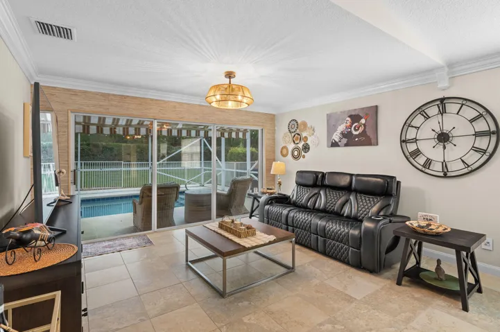 Living room off the pool enclosure - offering seamless indoor/outdoor living