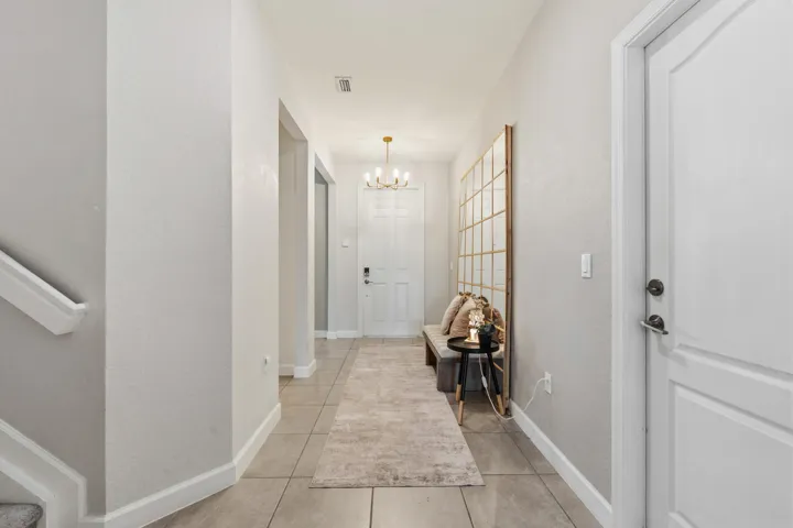 A bright foyer with soaring ceilings provides an inviting entrance and excellent flow throughout the home.