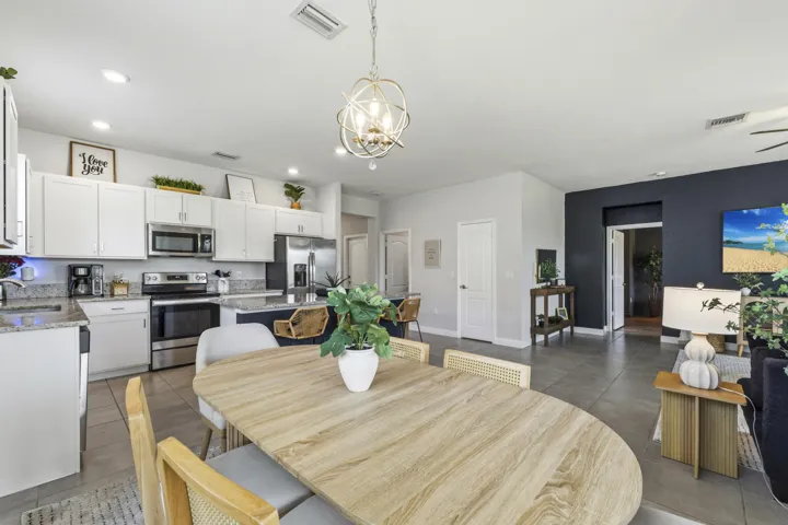 A spacious dining area flows effortlessly into the kitchen and living room for easy entertaining.