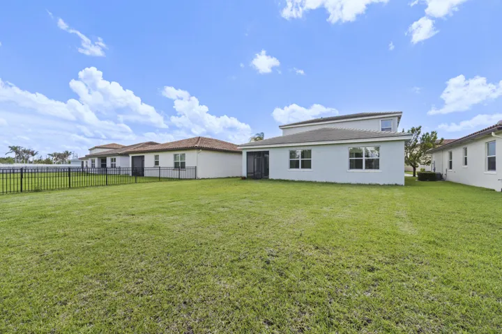 Large backyard with plenty of room for a pool, play, or entertaining.