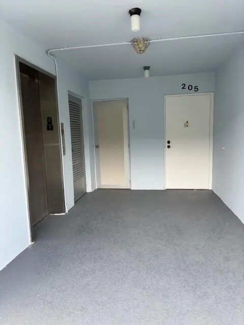 Front Door near elevator and laundry