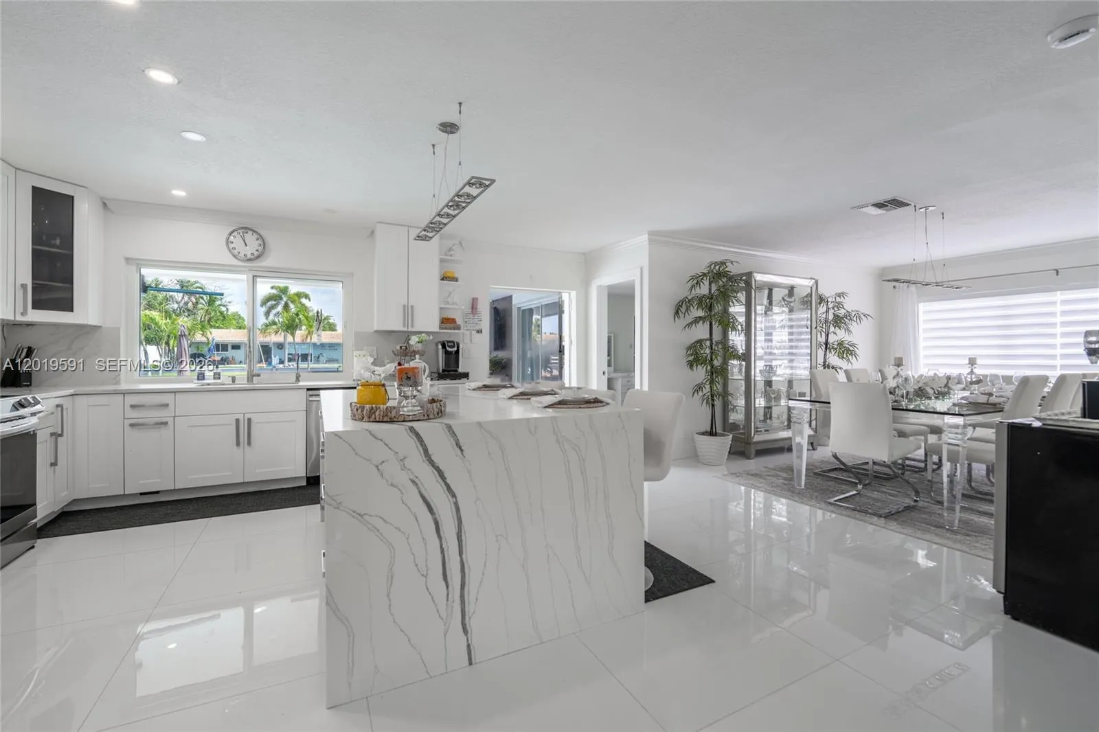 Modern open kitchen and living space designed for entertaining, comfort, and luxury vacation living.