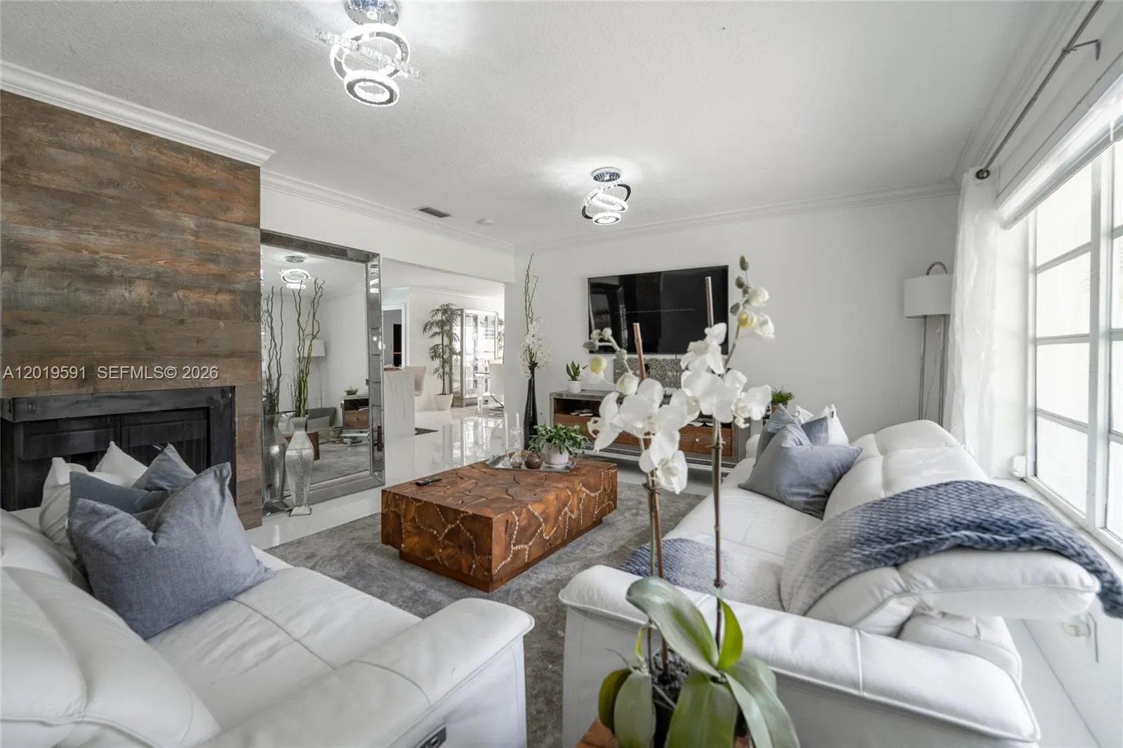 Elegant open-concept living space with modern décor, comfortable seating, and bright natural lighting.