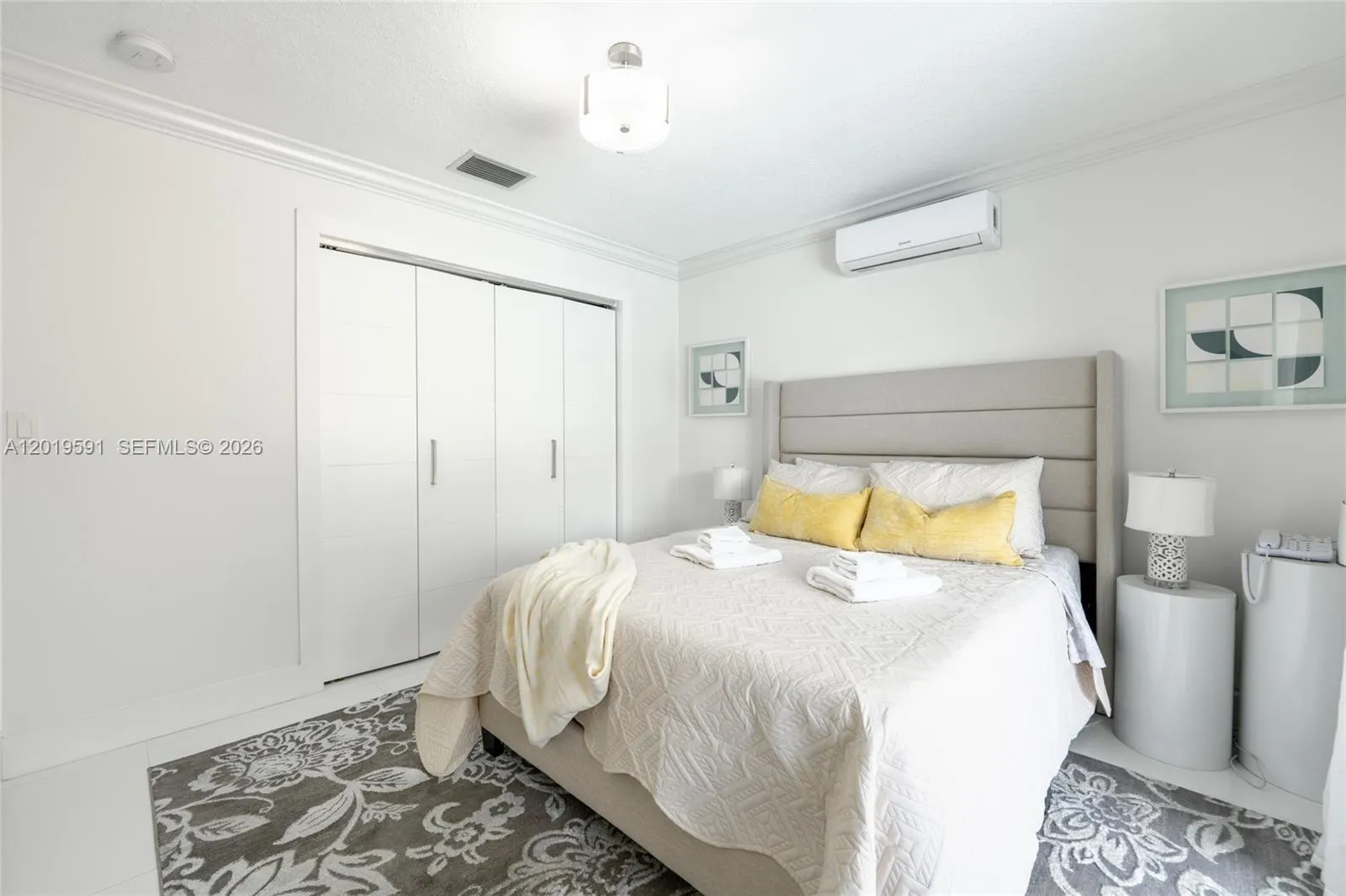 Contemporary guest bedroom with stylish finishes, cozy ambiance, and comfortable luxury accommodations.