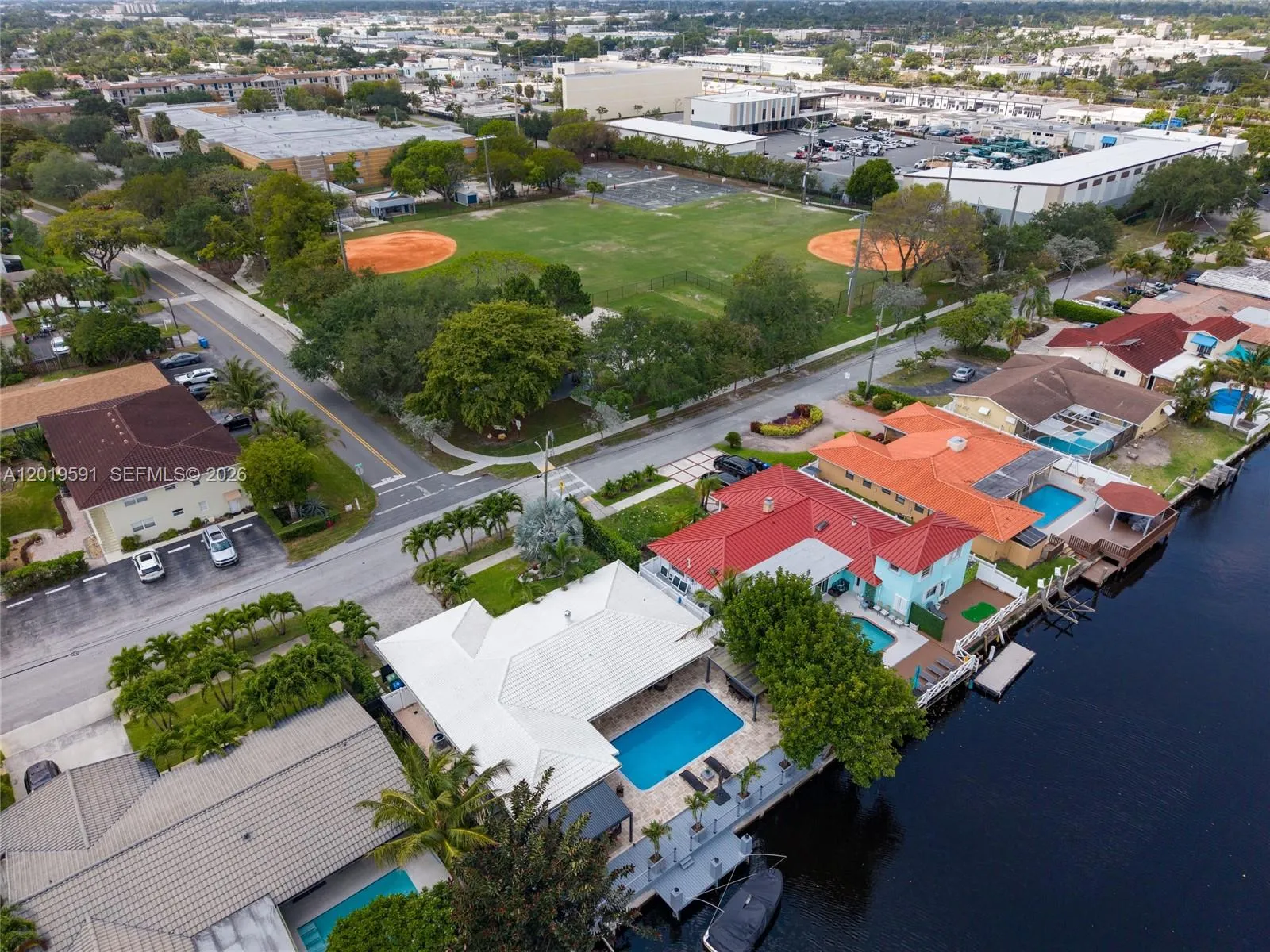 Aerial waterfront view showcasing canal-front living and prime Fort Lauderdale neighborhood location.