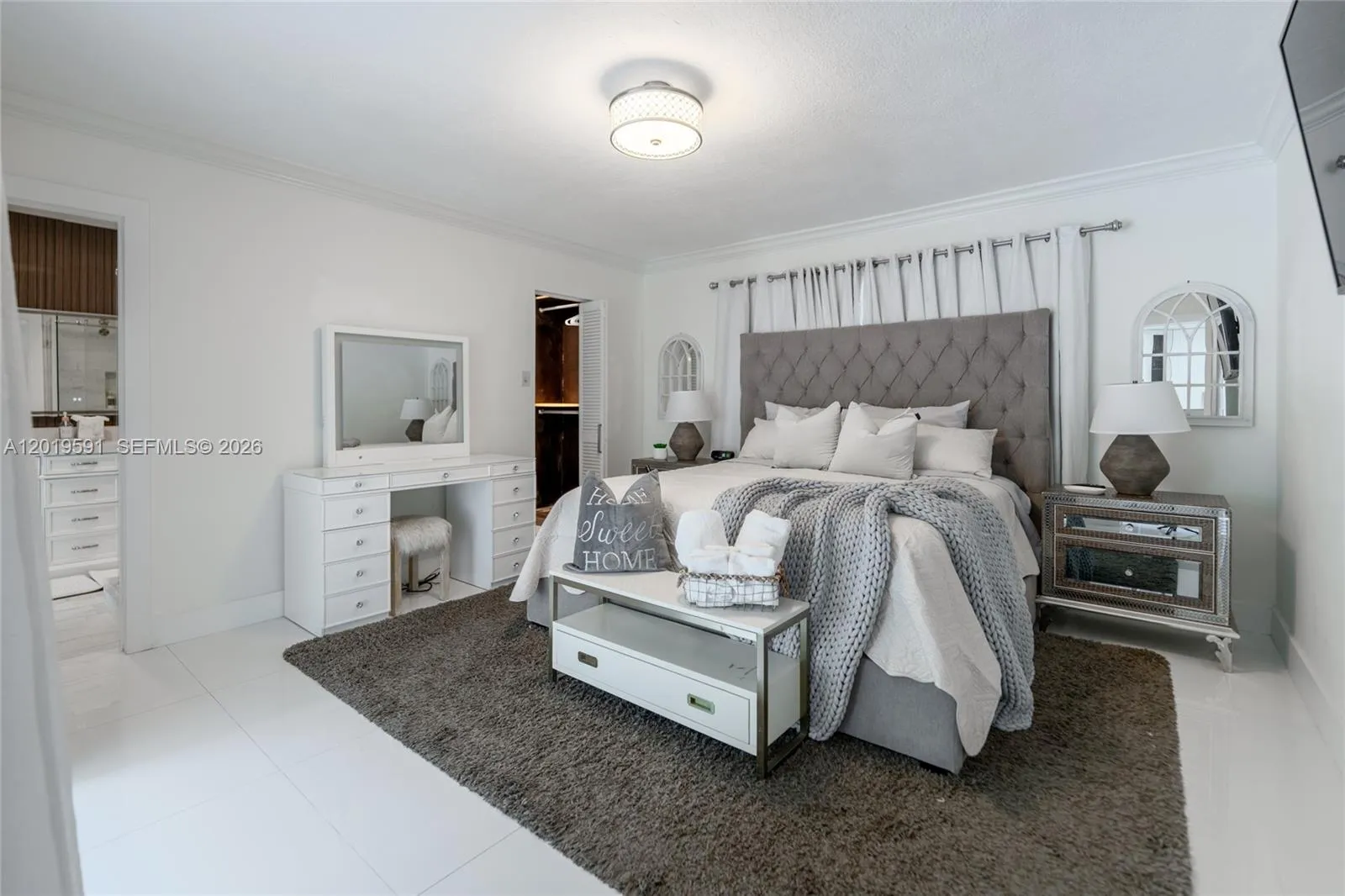 Spacious primary bedroom with elegant décor, luxury furnishings, and relaxing resort-style atmosphere.