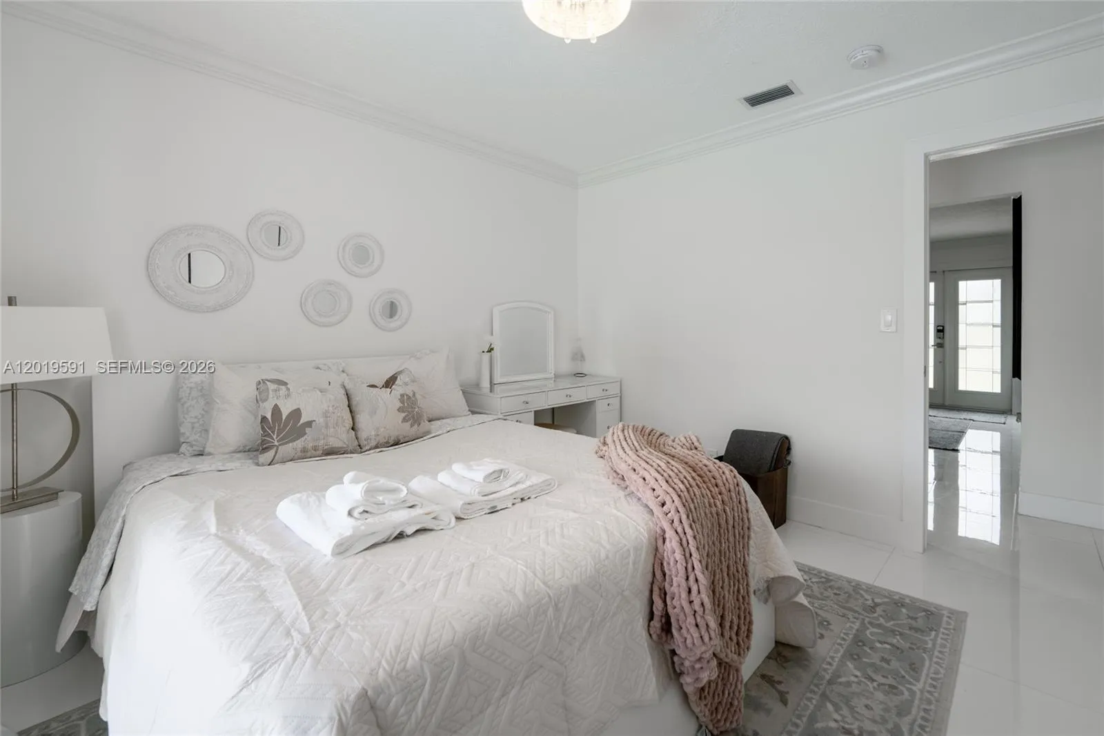 Cozy modern guest bedroom with elegant décor, soft natural lighting, and relaxing vacation retreat atmosphere.