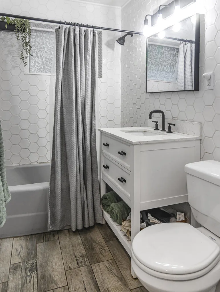Updated vanity, lighting and plumbing fixtures.