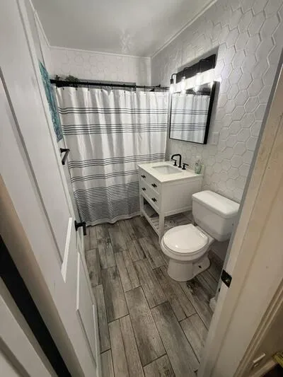 Updated vanity, lighting and plumbing fixtures.