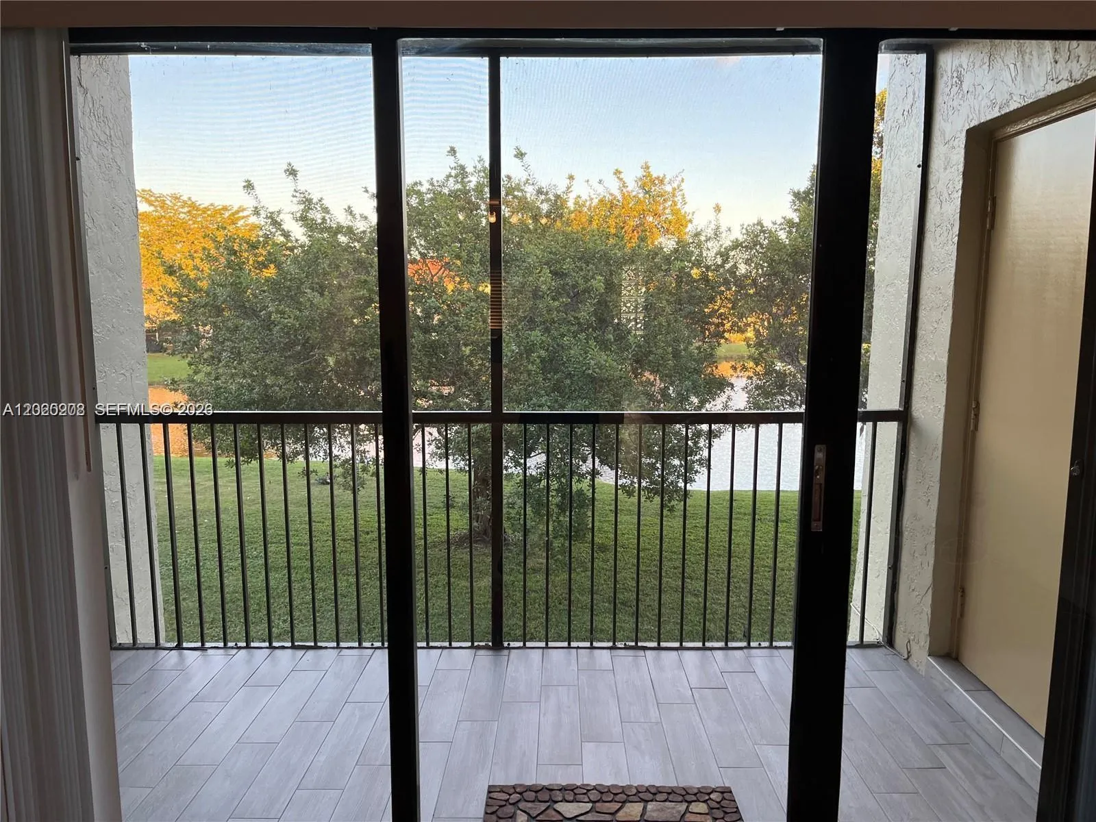 BALCONY W/ VIEW TO LARGE LAKE & DEPOSIT