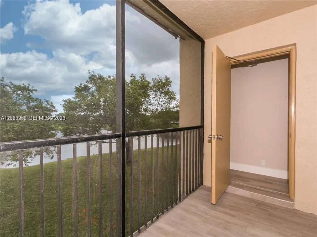 BALCONY W/VIEW TO LARGE LAKE &DEPOSIT