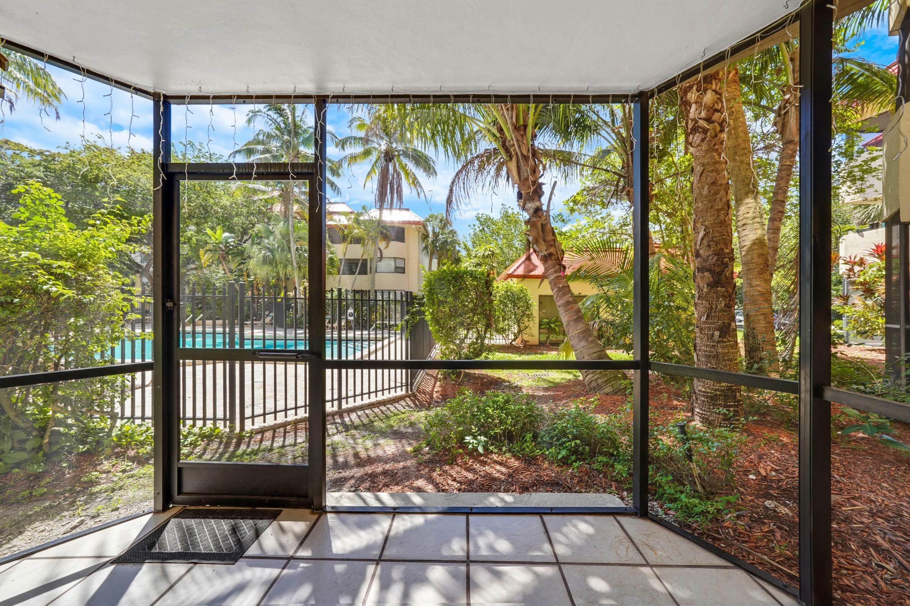 Screened patio with view of pool