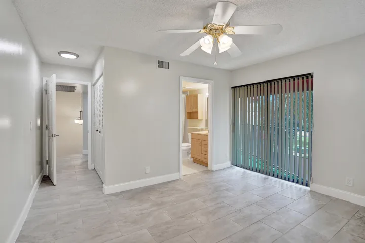 Primary Suite with private bath and balcony access