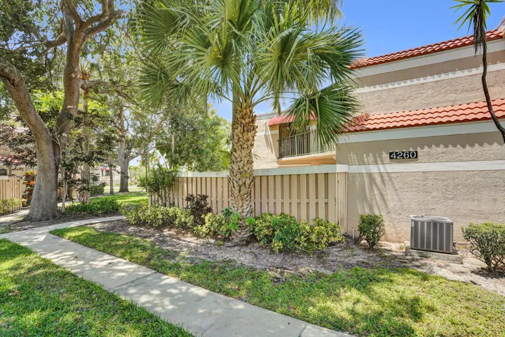 Lush Landscaping and park like setting infront of this residence