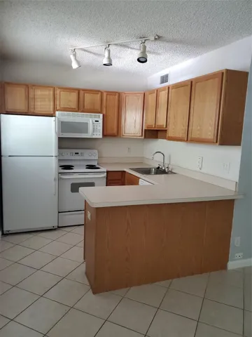 Open kitchen has lots of cabinet space