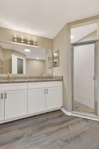 Primary BA Updated Granite Double Vanity & Modern Lighting
