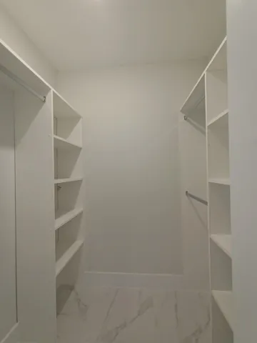 One of Two Custom Made Walk-In Closets