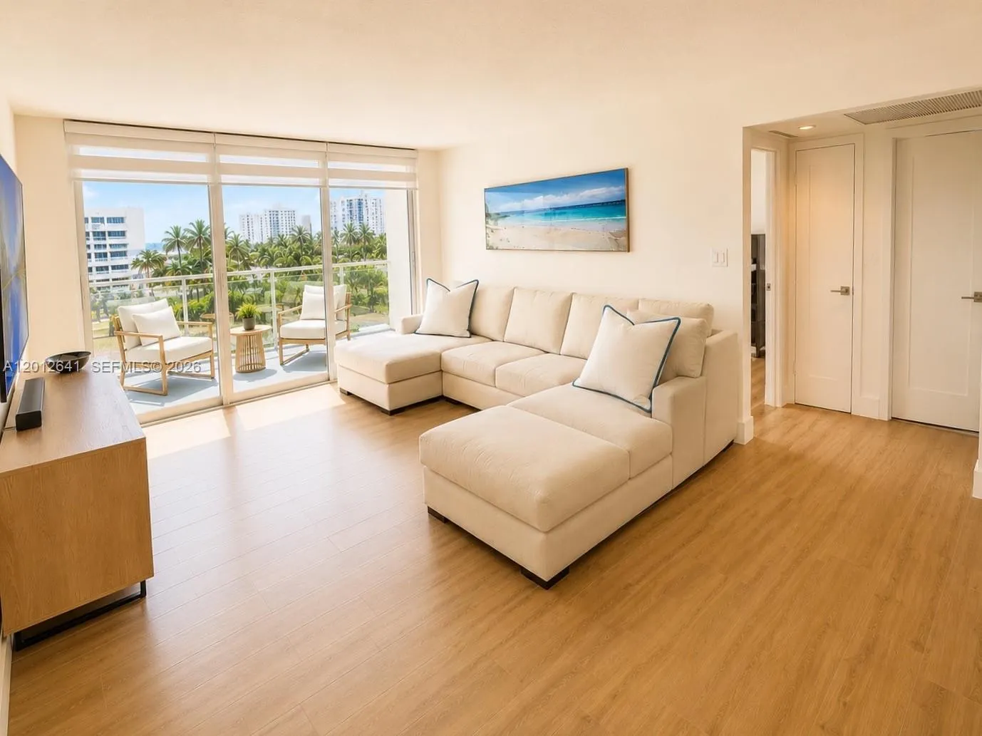 SPACIOUS LIVING / DINING ROOM COMBINATION OFFERS CONTEMPORARY OPEN-FLOOR PLAN WITH EASY ACCESS OCEANSIDE TERRACE PERFECT FOR WARM BREEZES AND CONVERSATION.