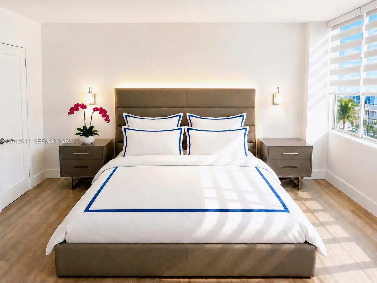 SPACIOUS BEDROOM SUITE OFFERS SITTING AREA AND TWO WALK-IN CLOSETS