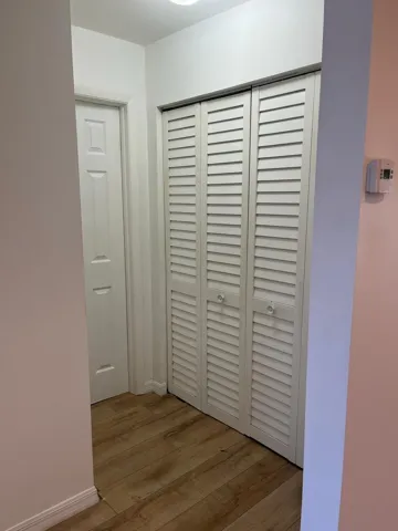 Closet Washer and dryer next to the guest bedroom