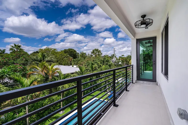 Private primary suite balcony offering serene, elevated outdoor retreat.