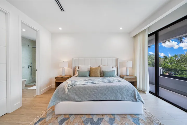 Private balconies extend from each east-facing bedroom with bright, open views.