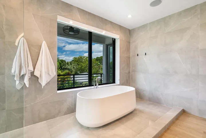 Soaking tub with a serene, expansive view for ultimate relaxation.