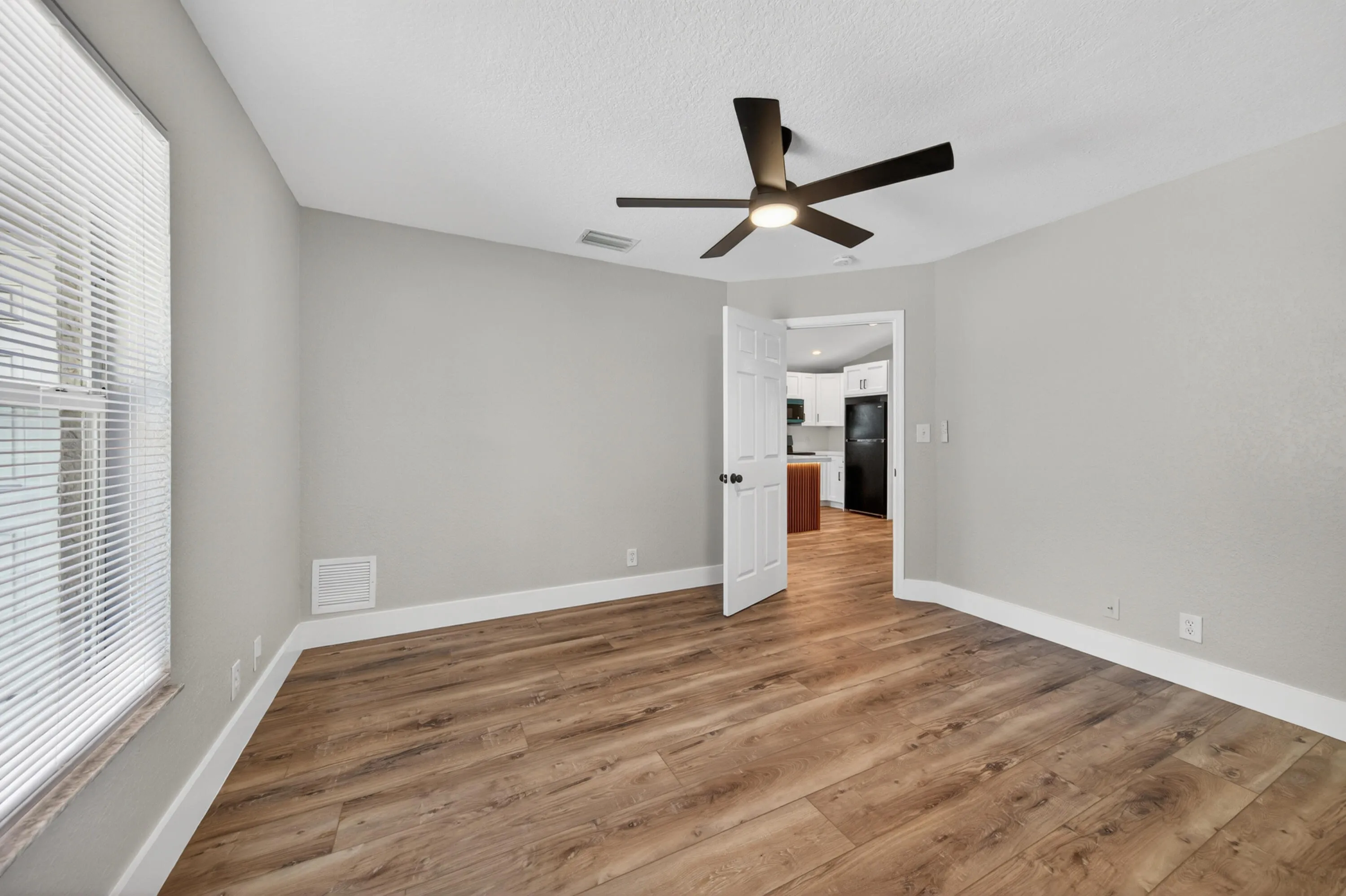 Bedroom 3 with natural light and updated flooring