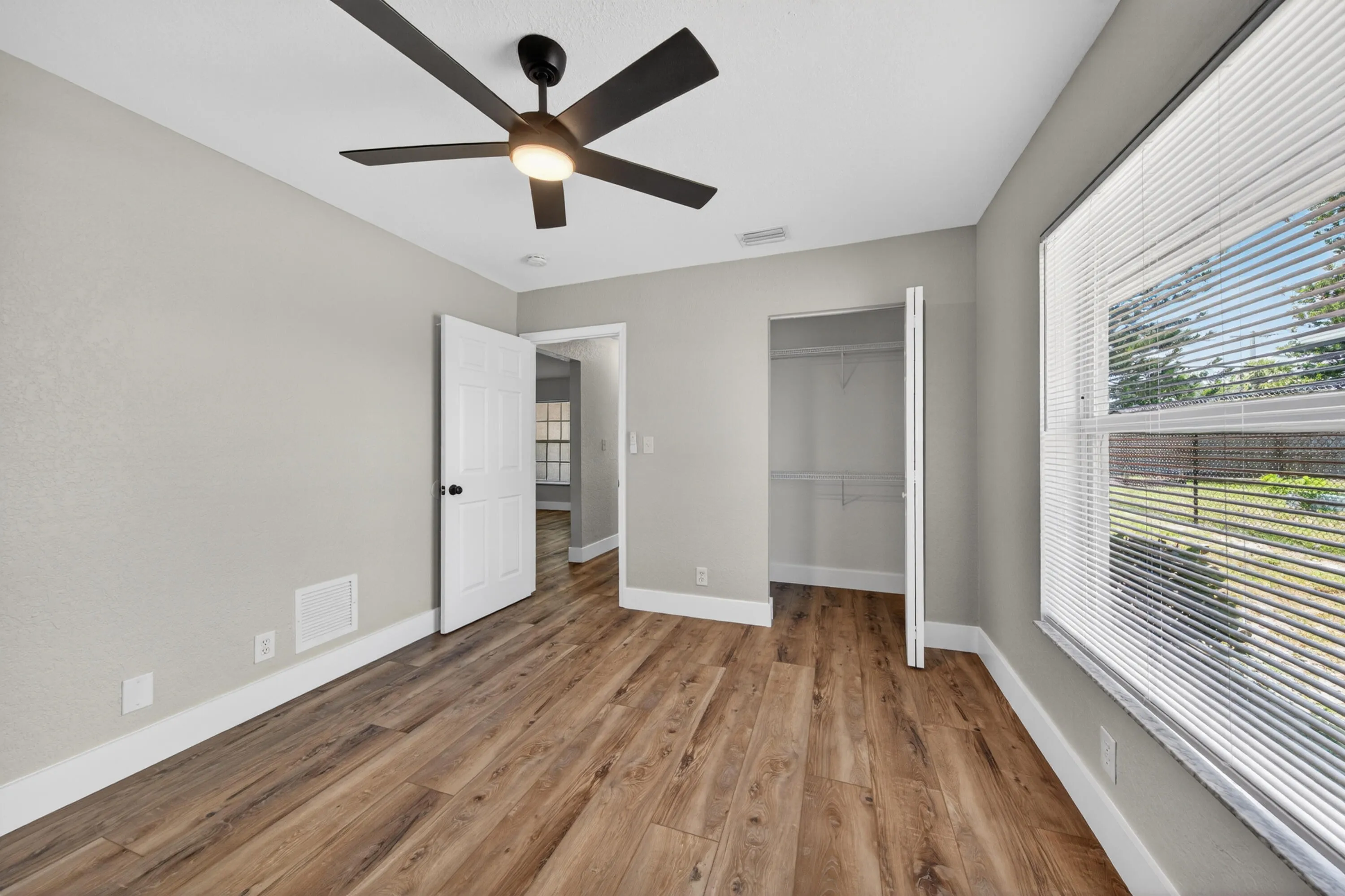Bedroom 3 featuring a bright layout and functional storage space