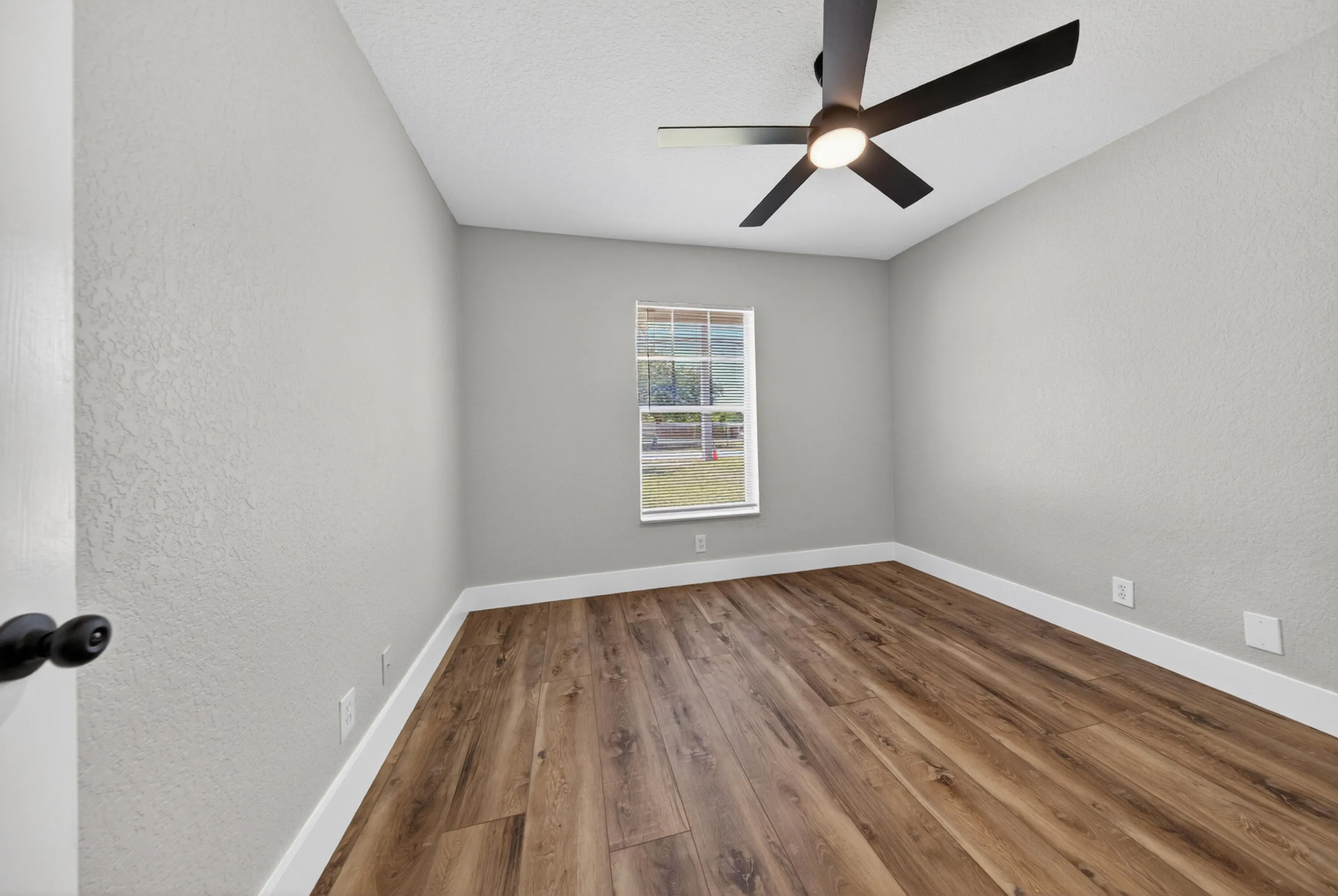 Bedroom 2 with natural light and a functional layout