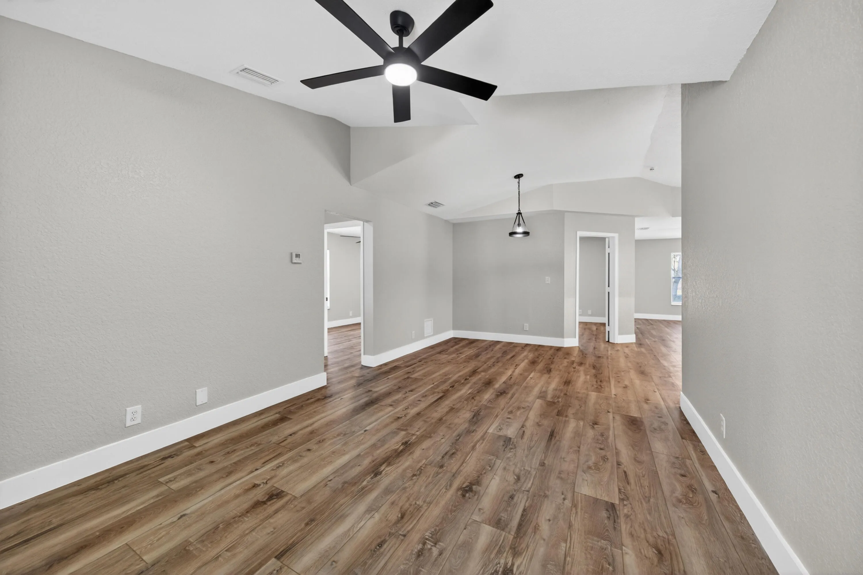 View showing the seamless flow between the main living area and kitchen