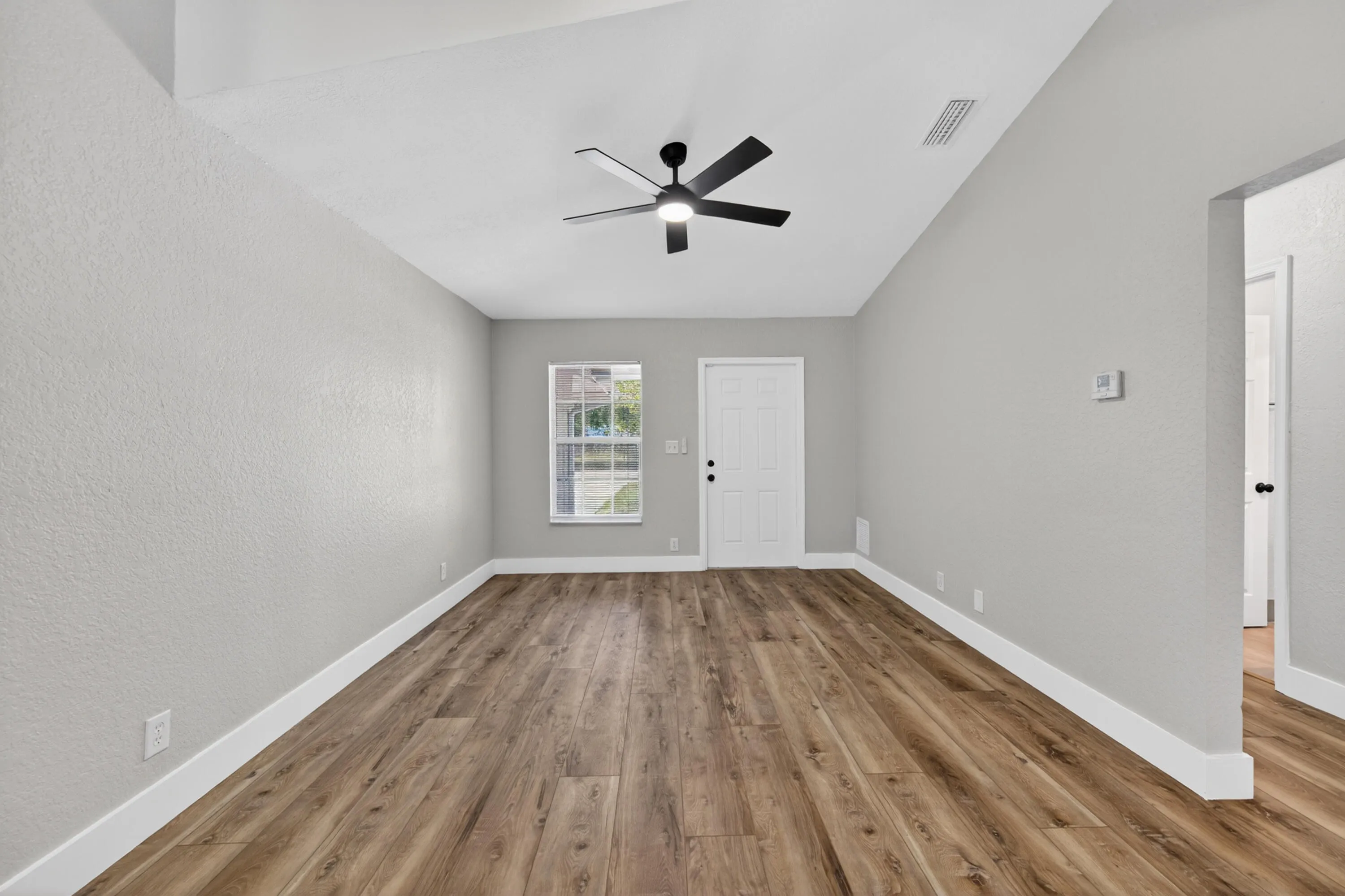 Entry view into the open living and dining area