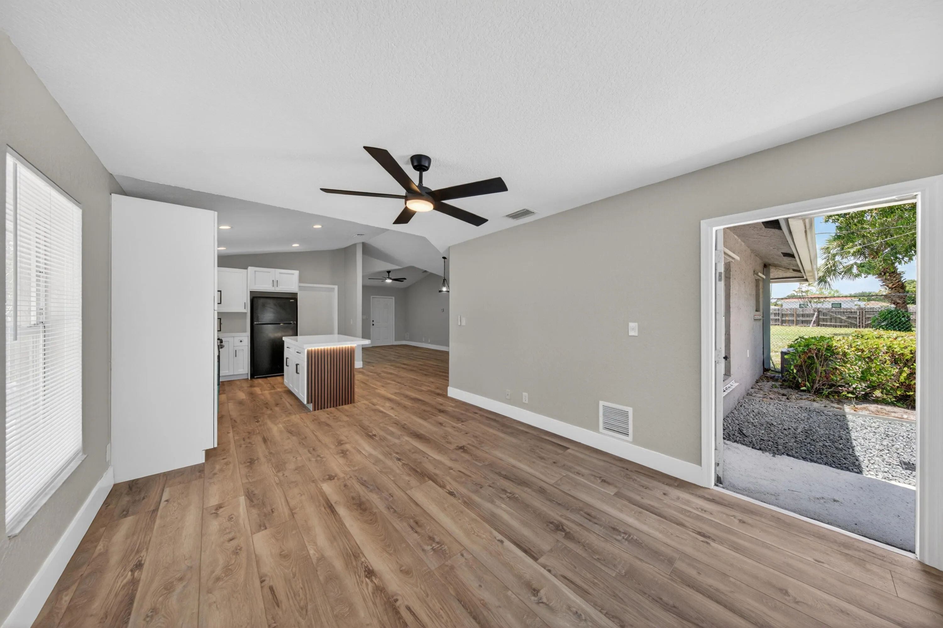 Living and dining area with access to the outdoor space