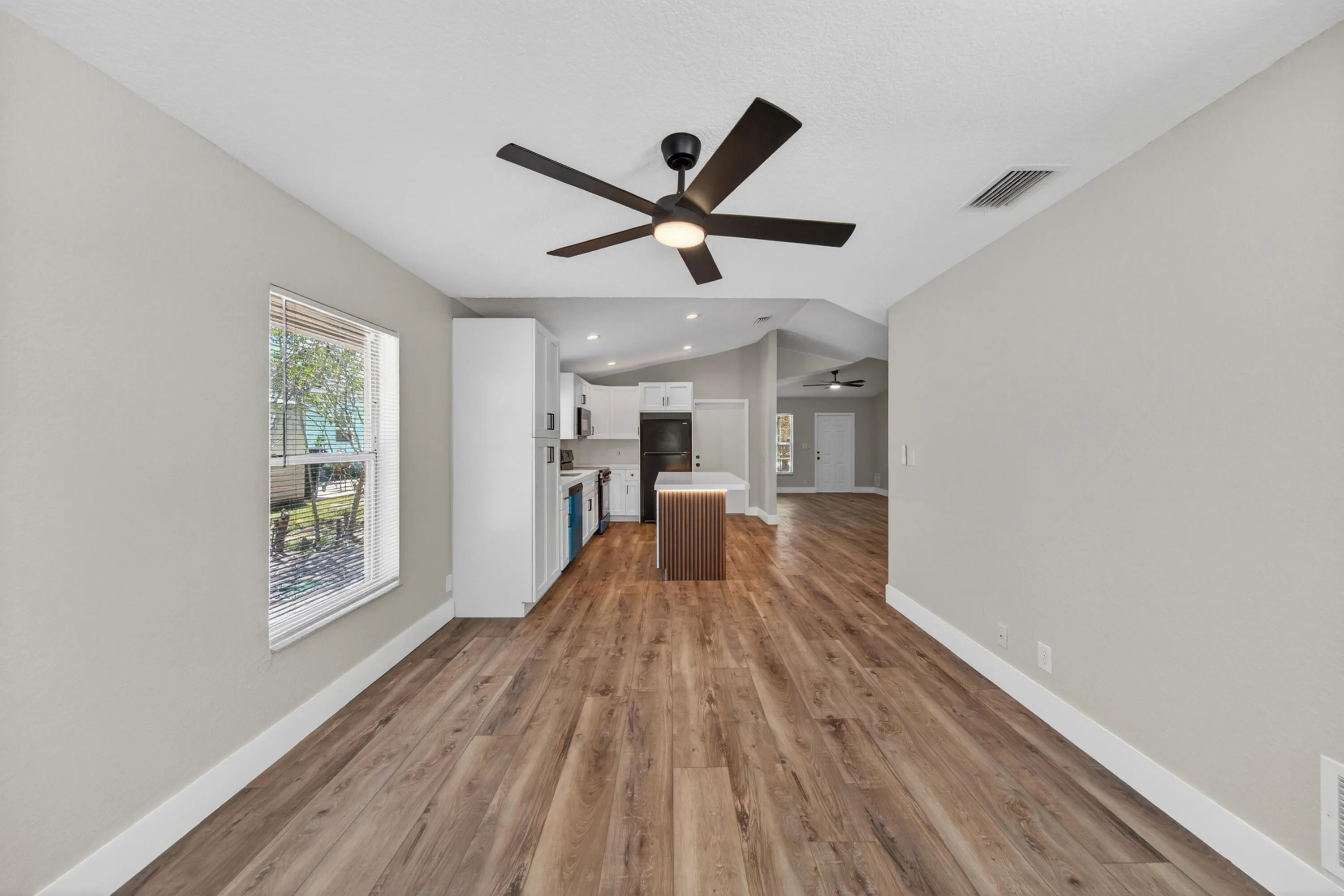Open living space with a clear view toward the kitchen and main areas
