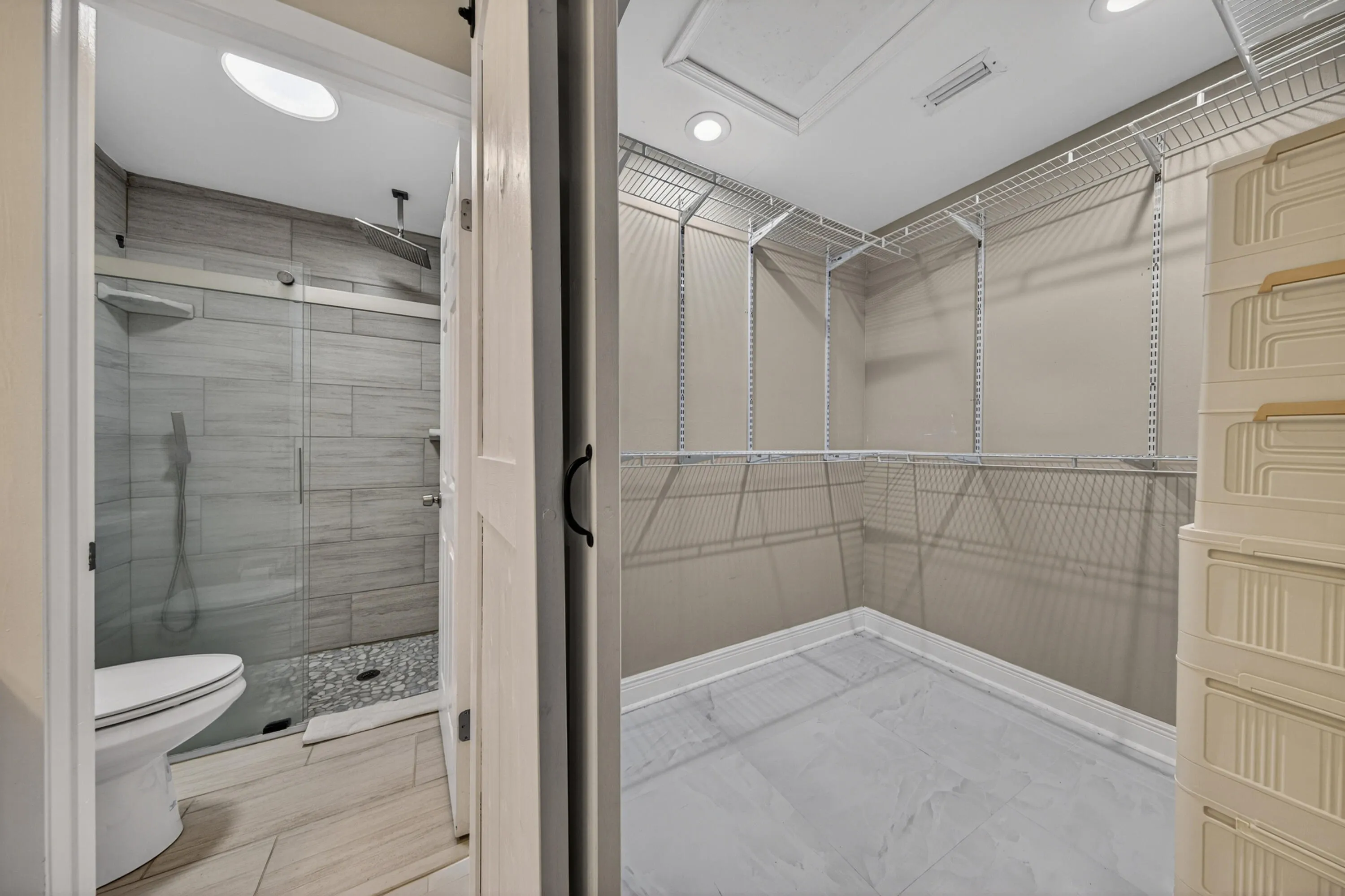 Large walk in closet with shelves