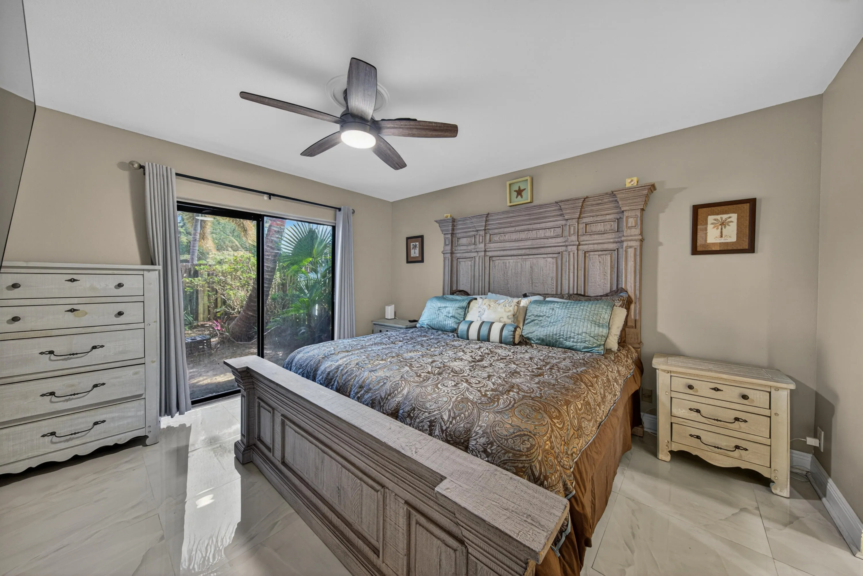Primary bedroom with sliding door to front courtyard