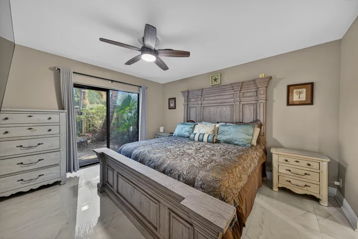 Primary bedroom with sliding door to front courtyard