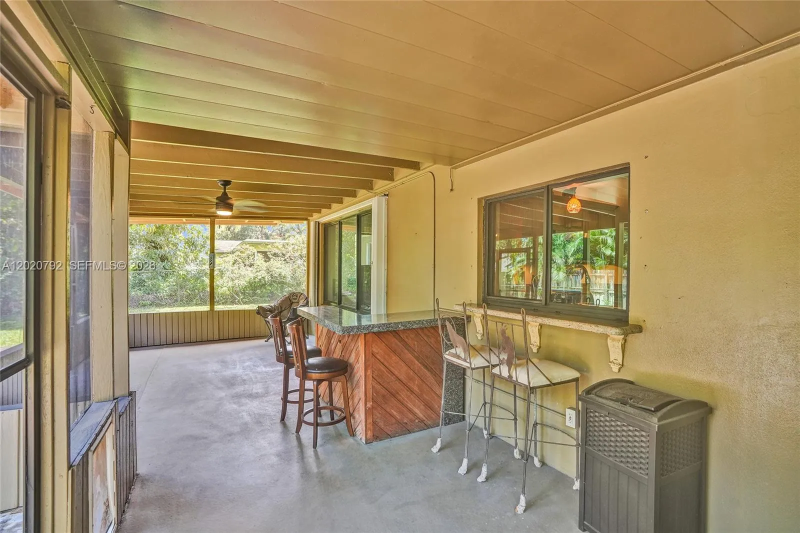 Screened in patio with outdoor bar