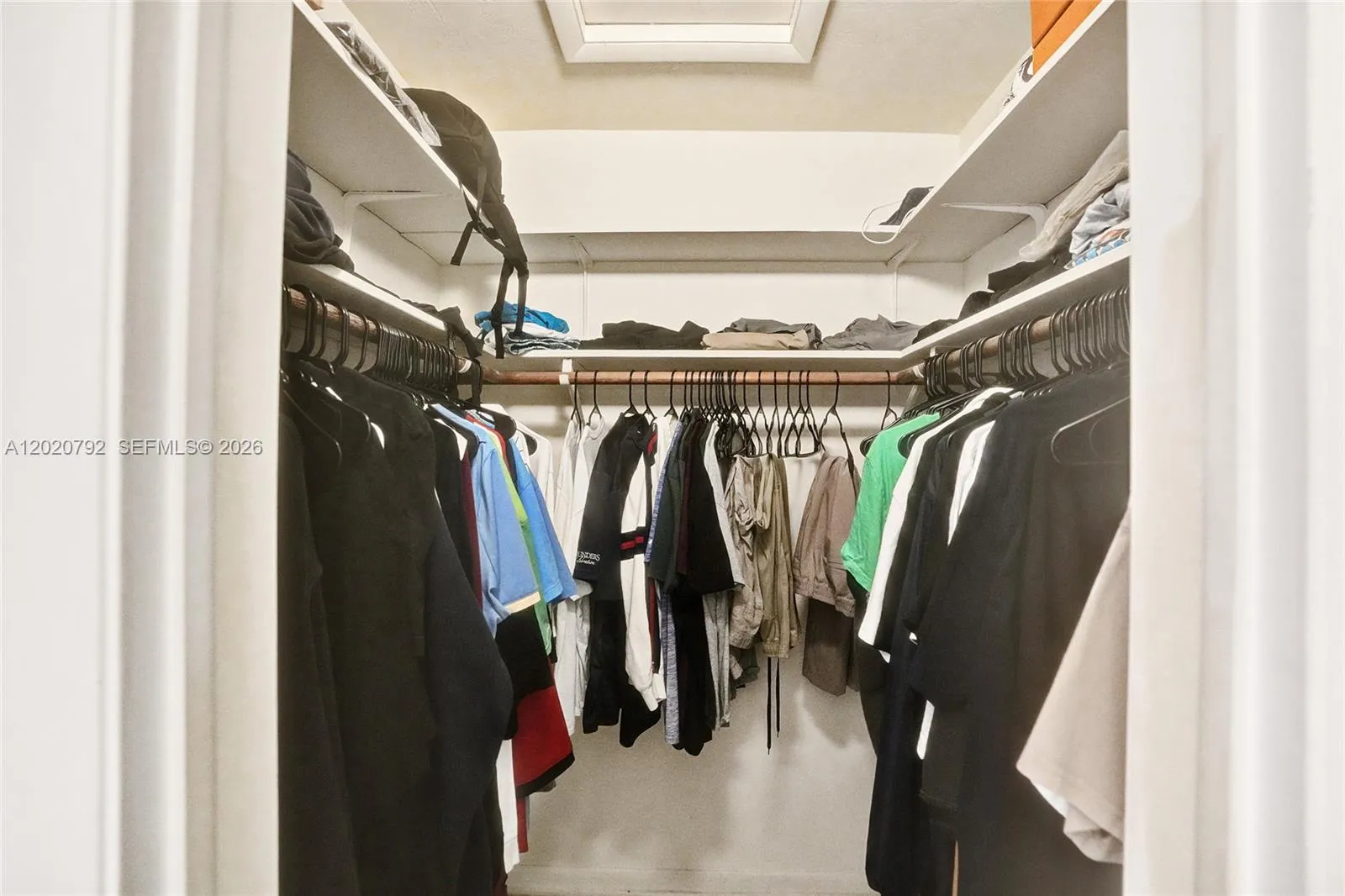 Primary bedroom walk in closet